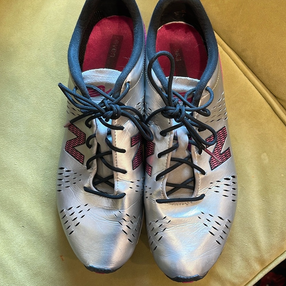 Silver and pink New Balance sneakers
